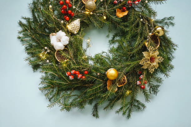istock Christmas composition, handmade christmas wreath on blue. 1339213937