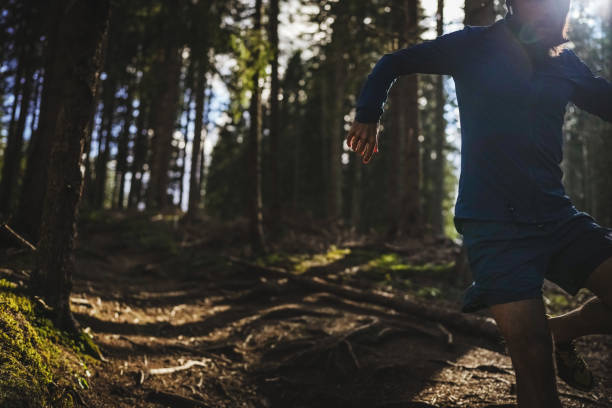 istock Man trail running in the forest 1339214955