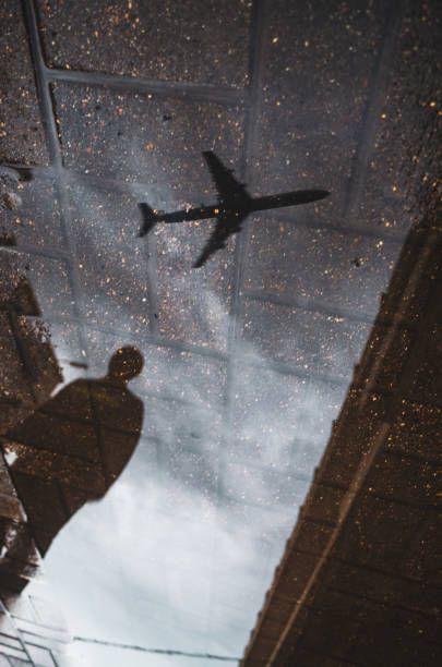 istock Blurred reflection on wet city sidewalk on rainy day 1339217010