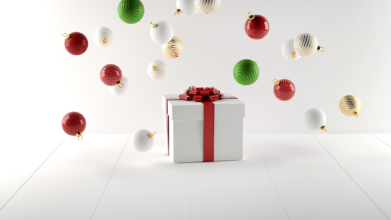 Cosmetic background for Christmas and winter holiday. White podium, christmas balls and snow on white background.