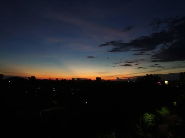 istock very colorful sunset with city lights 1339218060