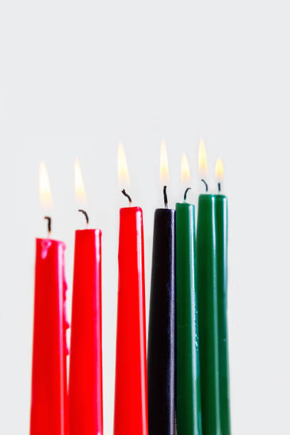 Kwanzaa candles on light background. Close up. Kwanzaa candles on light background and copy space on top. Afro-American holiday. Seven candles as symbol of principles of African Heritage. angolan kwanza photos stock pictures, royalty-free photos & images