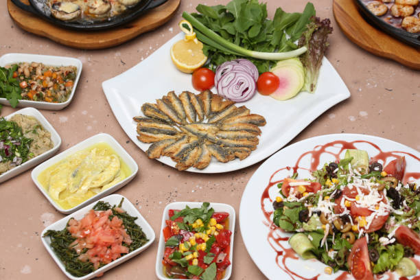 istock fried fish, salad and appetizers 1339223018
