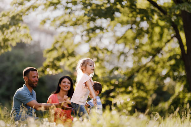 istock Happy family spending a spring day at the park. 1339224262
