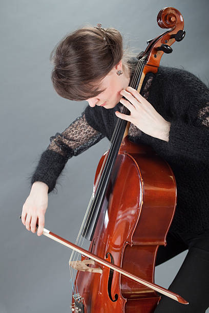 istock Young women play violoncello 133922676