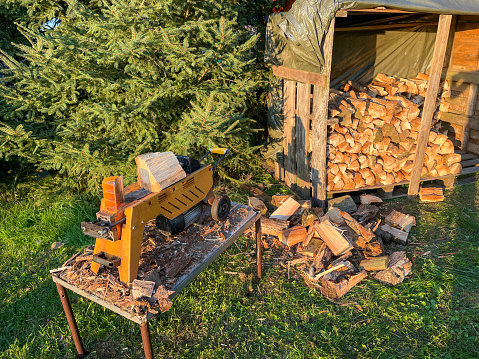 Log splitter with firewood for the winter