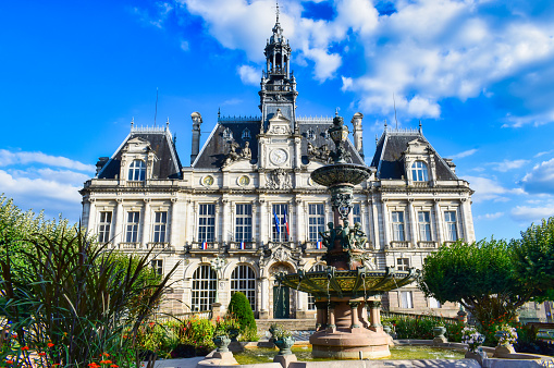 Square with fountain and town hall of Limoges in France