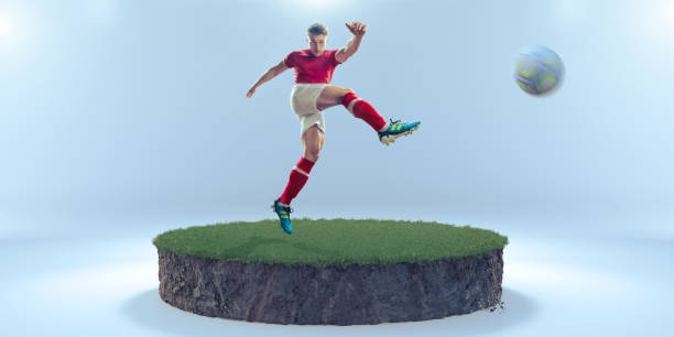 jugador de fútbol masculino en el aire pateando fútbol de volea sobre una sección transversal circular de hierba y barro - volley kick fotografías e imágenes de stock