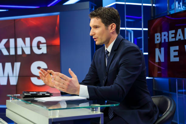 istock Breaking news male anchor 1339237266