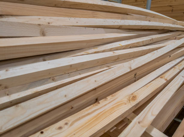 istock pile of long square section wooden sticks, slightly bent 1339237627