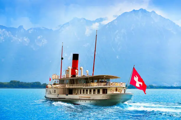 Geneve Lake Leman Geneva paddle steamer ship Switzerland with Swiss flag