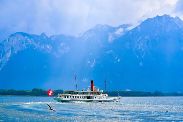 Geneve Lake Leman Geneva paddle steamer ship Switzerland with Swiss flag