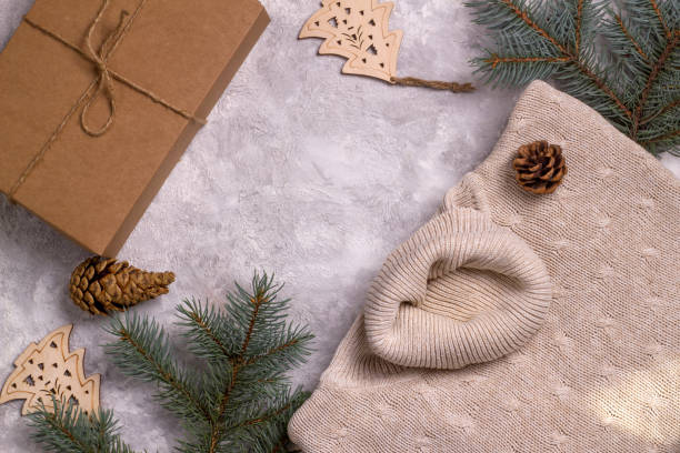 istock Winter handmade sweater and eco gifts on a light background. 1339239309
