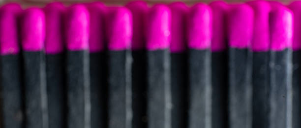 istock set of black cardboard matches with the head or red flammable material.  blurred image 1339239472