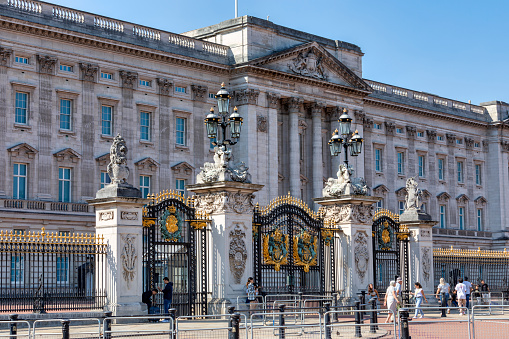 Stylish wrought iron gate and stone pillars