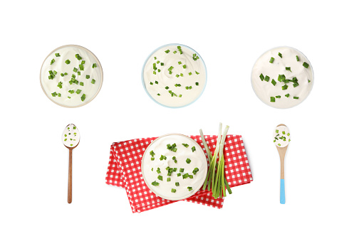 Set of delicious sour cream with onion on white background, top view
