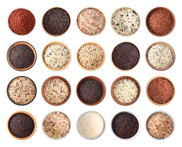 istock Set with different types of rice in bowls on white background, top view 1339241692