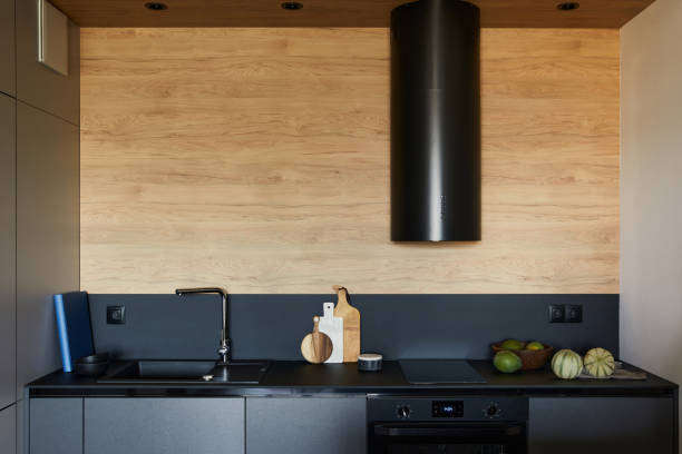 istock Stylish composition of modern  kitchen interior in small apartment. Black panels and kitchen accessories.. Creative wall. Template. 1339241733