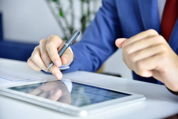 istock Accountant man checks business report 1339243405