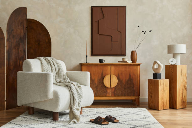 istock Stylish composition of modern living room interior with structure painting, folding screen, vintage commode, armchair, wooden cubes and accessories. Creative wall, carpet on the floor. Template. 1339245446