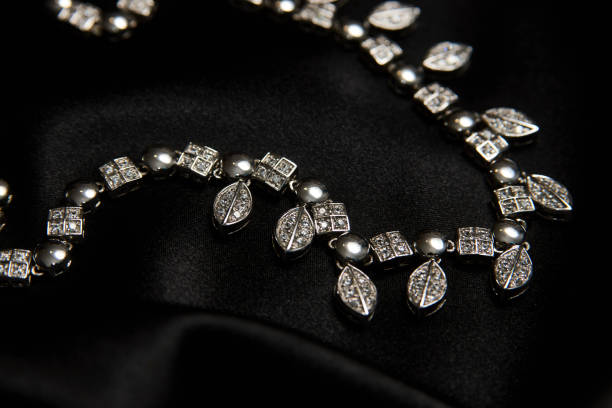 istock Necklace with diamonds on black background with copy space 1339246701