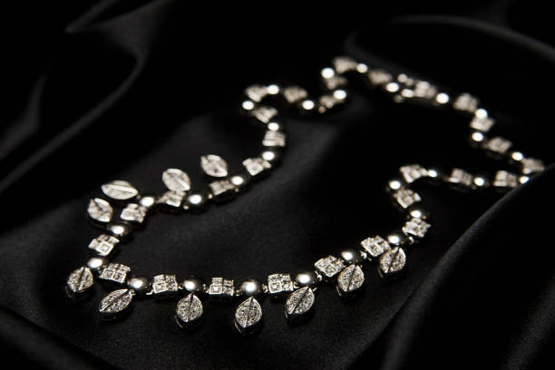 istock Necklace with diamonds on black background with copy space 1339246705