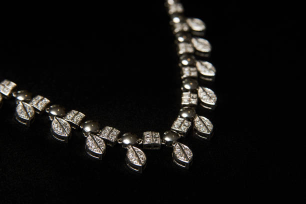 istock Necklace with diamonds on black background with copy space 1339246706