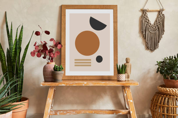 istock Creative composition of stylish living room interior with mock up poster frame, cacti and personal boho accessories. Plant love and nature concept. Template. 1339246707