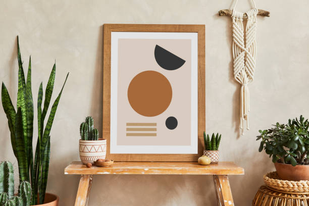 istock Creative composition of stylish living room interior with mock up poster frame, cacti and personal boho accessories. Plant love and nature concept. Template. 1339246730