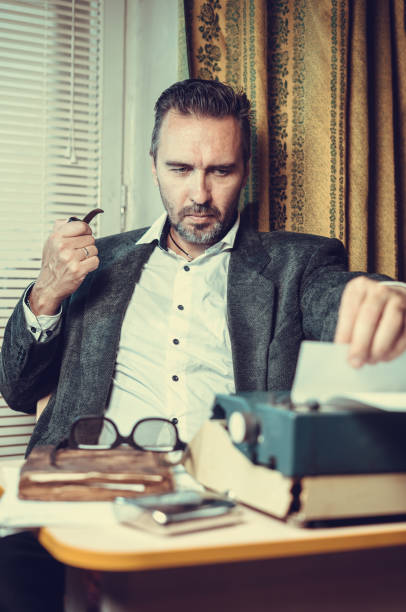 istock Vintage female writer reporter working behind his desk 1339246736