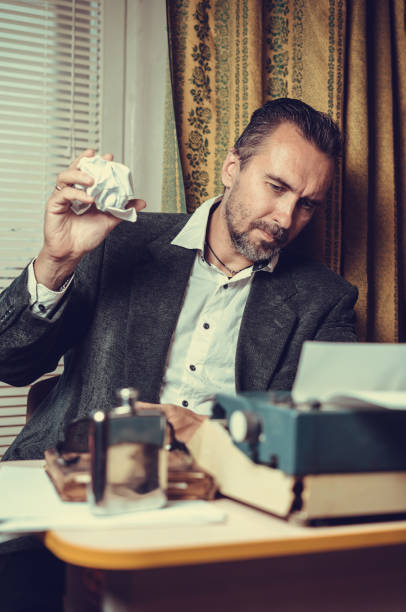 istock Vintage female writer reporter working behind his desk 1339246743