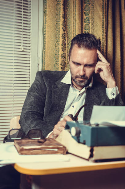 istock Vintage female writer reporter working behind his desk 1339246770