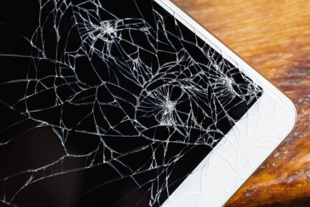 istock Smartphone with broken display screen is lying on the wooden bench. Closeup, selective focus 1339248354