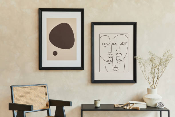 istock Creative composition of stylish modern living room interior with two mock up poster frames, black geometric commode, armchair, lamp and personal accessories. Neutral colours. Template. 1339248474