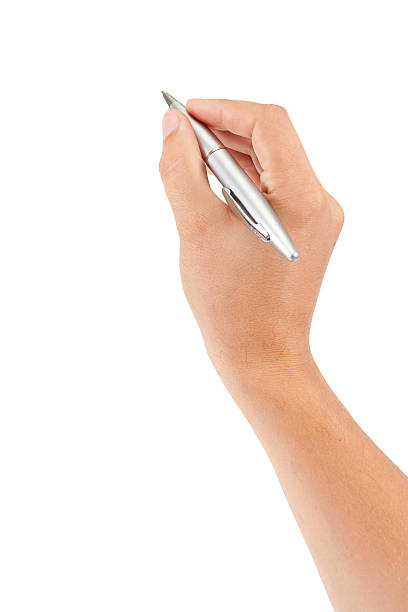 istock A hand with a silver pen writing on a white background 133925008
