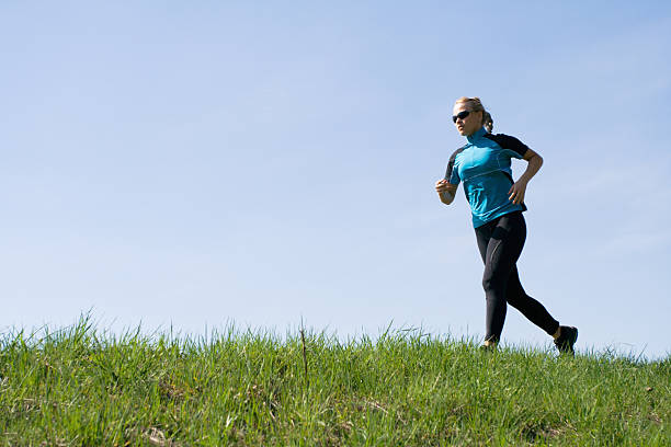 istock Woman running outdoors 133925412