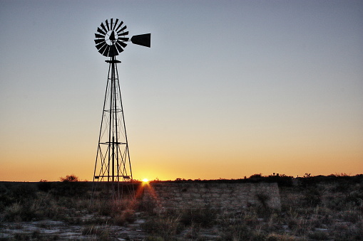 A windmill at sunset near Seminole Canyon Texas
