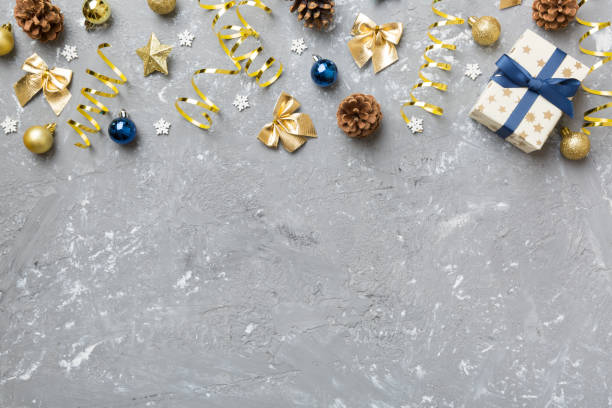 istock New Year composition. Christmas decor background with pine cones. Top view with copy space 1339256521