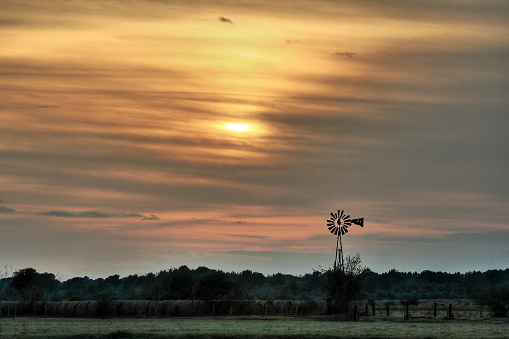 A windmill at sunset near Tomball Texas