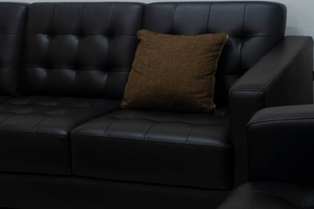 istock Black sofa in the meeting room, complete with pillows 1339260646