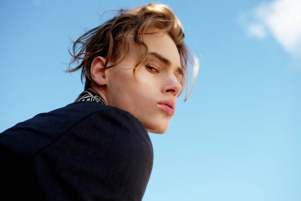 handsome fashionable young man in a suit handsome fashionable young man in a suit posing outdoor hot handsome man stock pictures, royalty-free photos & images