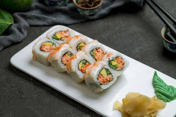 istock roll with spicy shrimp and crab on dark stone table side view 1339263178