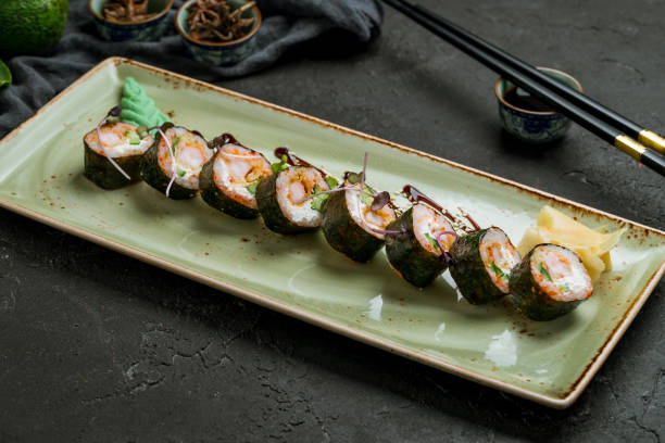 istock shrimp tempura rolls on white plate on dark stone table 1339263181