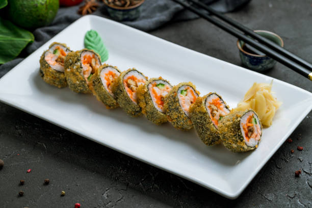 istock hot shrimp roll with eel on white plate on dark stone table 1339263960