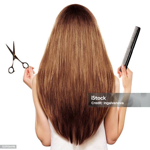 Rear View Of A Woman With Long Brown Hair Holding Scissors Stock Photo - Download Image Now