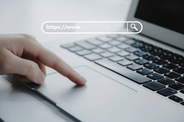 istock people hand touching touchpad on laptop computer with www search bar graphic on desk at home office, job search, social network, internet online, search engine, finance, digital technology concept 1339266603