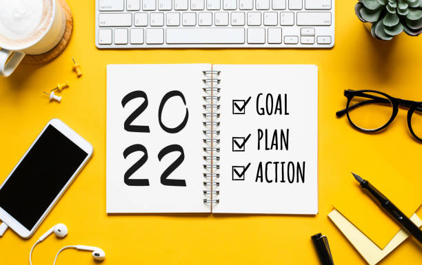 istock 2022 new year goal,plan,action concepts with text on notepad and office accessories.Business management 1339266840