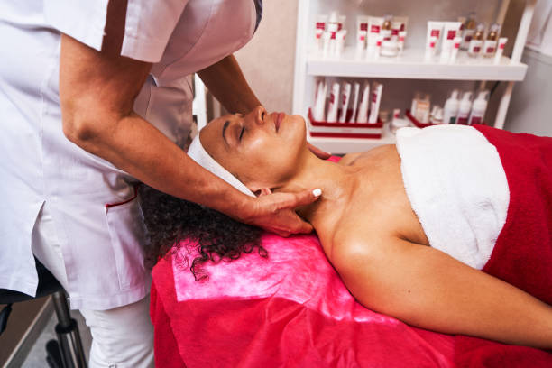 istock Competent cosmetologist doing massage on neck and shoulder 1339268734