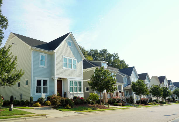 New homes on a quiet city street in Raleigh North Carolina New homes on a quiet city street in Raleigh NC suburb stock pictures, royalty-free photos & images
