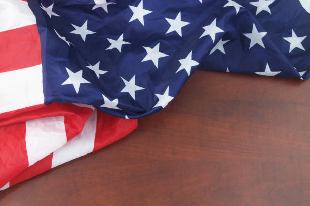 istock American flag on wooden background. 1339273760